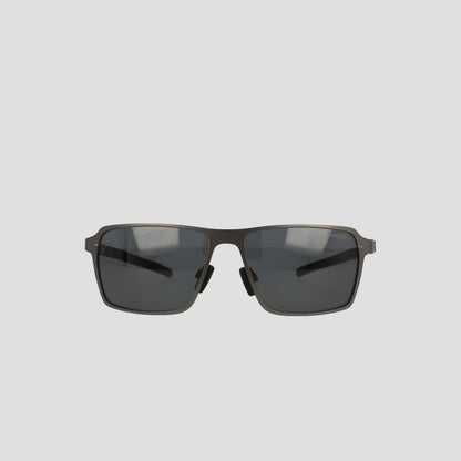 Champion Men’s Polarized Sunglasses feature dark lenses and a slim, dark stainless steel frame, displayed against a plain light grey background.