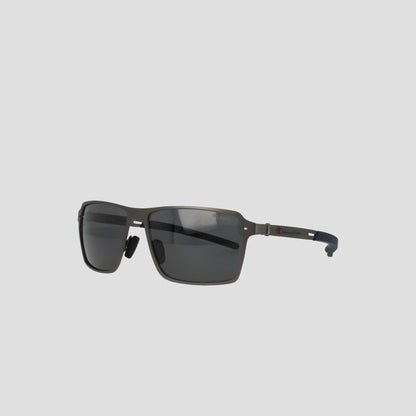 The Champion Men's Polarized Stainless ST-Shirtl Comfort Fit sunglasses feature a modern rectangular design with black polarized lenses and thin metal arms, crafted from lightweight stainless steel, displayed on a light gray background.