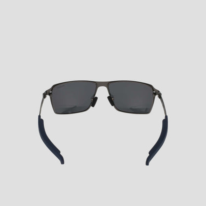 Front view of Champion Men's Polarized ST-Shirtl Comfort Fit sunglasses, featuring black rectangular frames, polarized lenses, blue adjustable rubber tips, and a lightweight stainless steel frame on a light gray background.