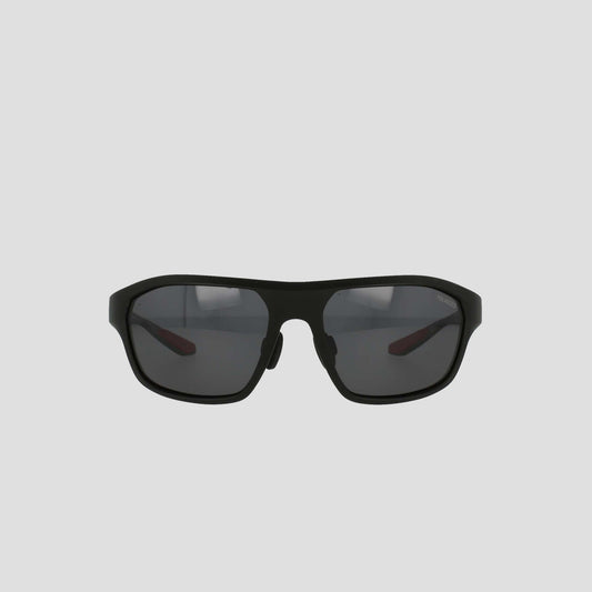 Champion Men's Polarized Comfort Fit - Large sports sunglasses, featuring a black, slightly curved TR90 frame with polarized lenses. The design includes adjustable rubber tips for enhanced comfort and a secure fit, displayed against a plain, light gray background.