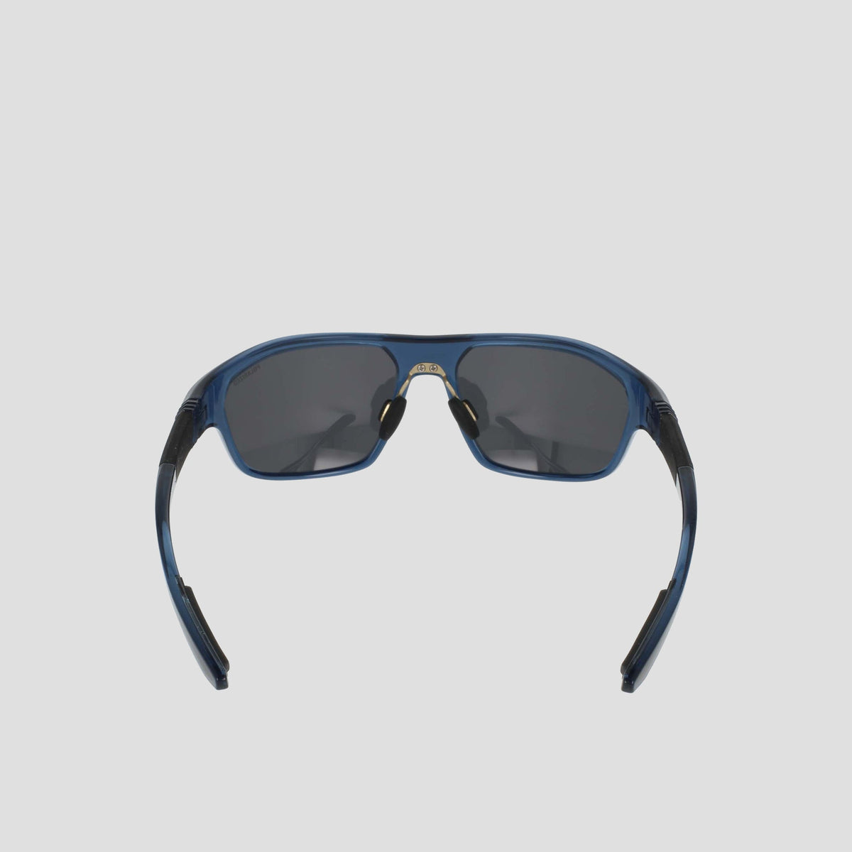 A pair of Champion Men's Polarized Comfort Fit - Large sports sunglasses are shown from the front against a light gray background. The blue TR90 frame offers lightweight durability, while the arms are slightly open and feature black detailing. The dark polarized lenses complete the look.