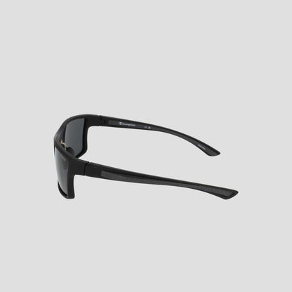 Men's Polarized Comfort Fit - Medium by Champion, featuring black wraparound frames with thick arms and a lightweight design, displayed from a rear side angle against a plain light gray background.