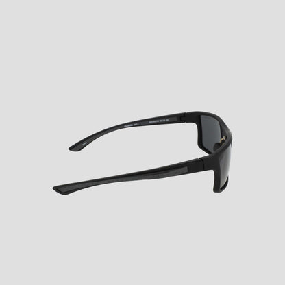 Side view of Champion Men’s Polarized Comfort Fit - Medium black rectangular sunglasses, featuring a lightweight frame and thick, dark lenses, set against a plain light gray background.