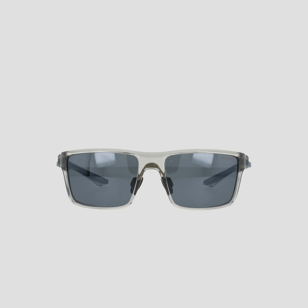 Men's Polarized Comfort Fit - Medium sunglasses by Champion, featuring a lightweight rectangular frame with a clear design and dark lenses, displayed against a plain light gray background.