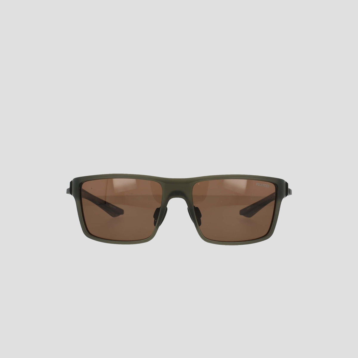 Front view of Champion Men's Polarized Comfort Fit - Medium sunglasses featuring rectangular olive green TR90 frames and brown tinted lenses, displayed against a plain light gray background.
