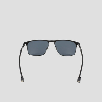 Men’s Polarized Retainer Stainless ST-Shirtl Square sunglasses by Champion, featuring a black square frame with dark polarized lenses. Shown from the front on a plain light background, the design includes curved arms with small rectangular ends.