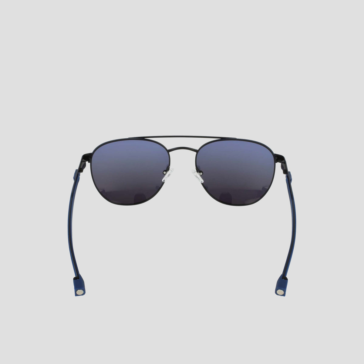 A pair of Champion Men's Polarized Retainer Stainless ST-Shirtl Aviator sunglasses with black rims, blue-tinted polarized lenses, and blue flexible temple tips, featuring an adjustable nose bridge, displayed against a plain light gray background.