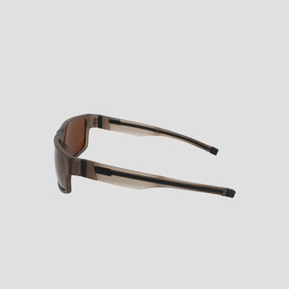 Champion Men's Polarized Retainer Rectangle sunglasses are shown in brown with wide arms, slightly tilted to the right. Featuring polarized lenses for enhanced clarity and glare reduction, they are displayed on a plain light gray background.