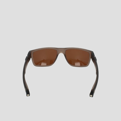 A pair of Champion Men's Polarized Retainer Rectangle sunglasses featuring brown-tinted polarized lenses and dark semi-transparent frames made from high-performance TR90 material, displayed front-facing against a light gray background.