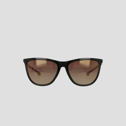 A pair of Champion Women's Polarized Retainer Rectangle sunglasses, featuring black frames and brown gradient lenses, is displayed against a plain light gray background, bringing a chic update to classic athleisure eyewear.