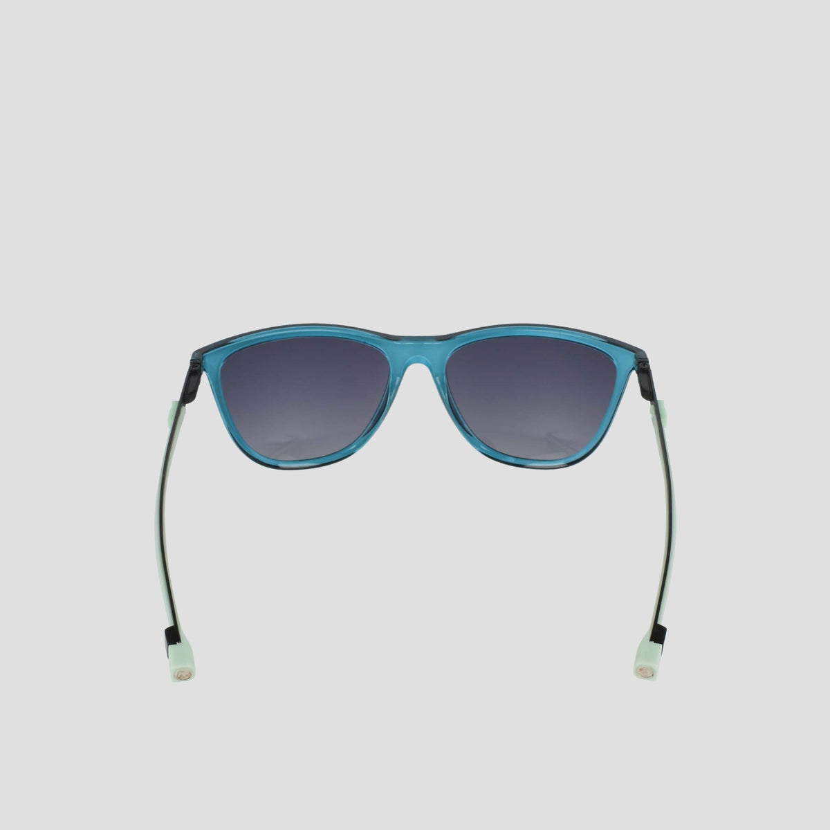 Champion Women's Polarized Retainer Rectangle sunglasses, featuring a blue frame and dark polarized lenses, are shown from the front. The straight temples end in pale green, translucent tips. Perfect for athleisure looks, these sunglasses are displayed against a light gray background.