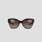 Front view of Champion Women's Polarized Retainer Square sunglasses, featuring an oversized design in handmade tortoiseshell acetate and gradient brown polarized lenses, displayed on a plain light gray background.