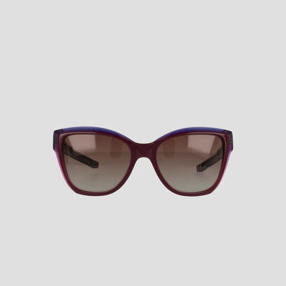 Front view of Champion Women's Polarized Retainer Square sunglasses featuring a bold square frame in dark purple and burgundy handmade acetate with brown gradient lenses, set against a plain light gray background.