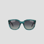 Front view of the Champion Women's Polarized Curvaceous Square sunglasses, featuring blue-green, high-shine acetate frames and dark gradient polarized lenses, set against a plain white background.