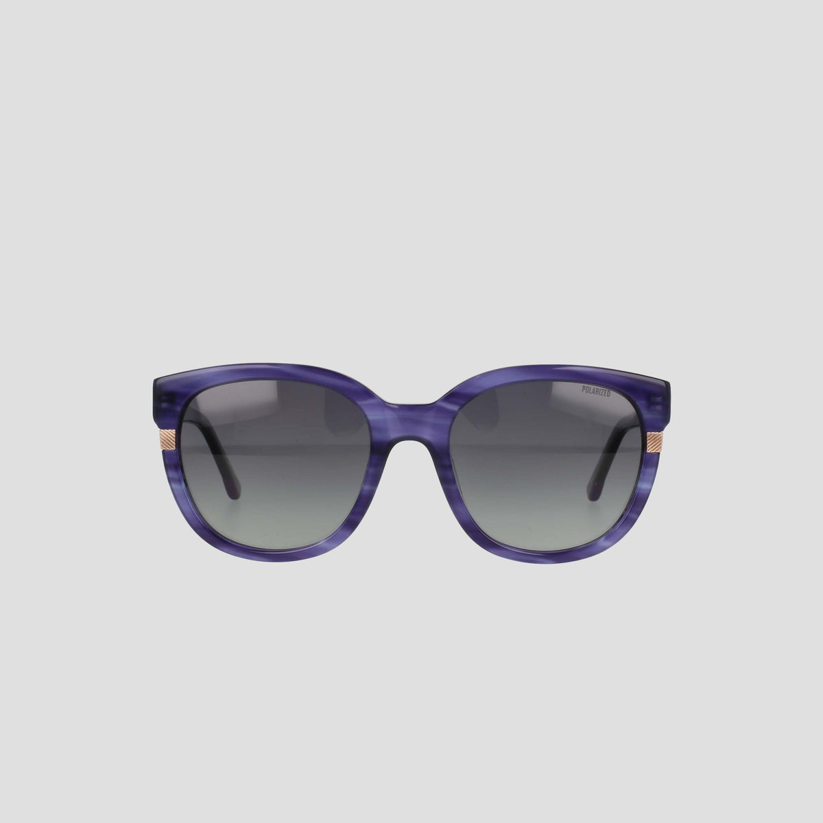 The Champion Women's Polarized Curvaceous Square sunglasses are shown from the front against a plain light gray background. These oversized purple sunglasses feature gradient dark lenses, a glossy acetate frame with subtle gold accents on the sides near the hinges, and an RX-able design for customized prescription lenses.