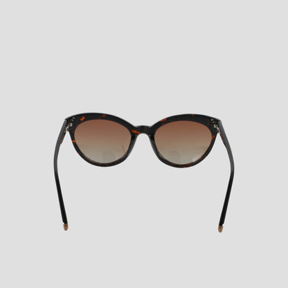 The Champion Women's Polarized Cateye sunglasses, featuring a brown tortoiseshell cat-eye frame and gradient brown polarized lenses, are displayed against a plain light gray background, facing forward with the arms slightly angled outward.