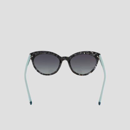 Champion Women’s Polarized Cateye sunglasses with a marbled pattern and light blue arms, featuring gradient lenses, shown on a plain white background.