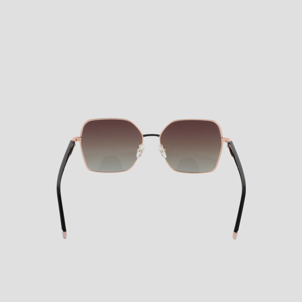 Women’s Polarized Boho Square sunglasses by Champion, featuring a thin rose gold metal frame, gradient dark lenses, and black arms, are displayed against a light gray background.