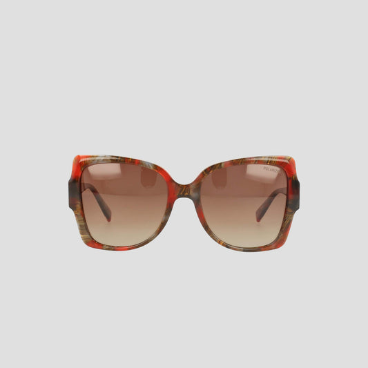 Champion Women's Polarized Oversized Butterfly sunglasses feature oversized, square frames in a red and brown tortoiseshell pattern with gradient brown polarized lenses. Crafted from handmade acetate for minimalist eyewear elegance, they are displayed against a plain light background.