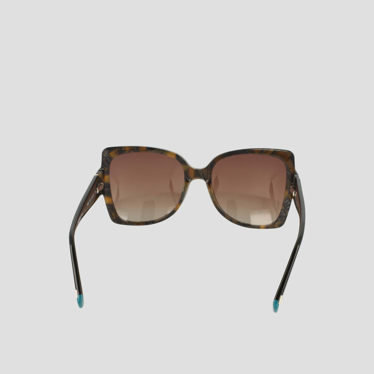 Champion Women's Polarized Oversized Butterfly sunglasses in brown tortoiseshell, showcased from the front against a plain light gray background. This minimalist pair features handmade acetate butterfly-shaped frames with gradient brown lenses and subtle blue detailing on the temple tips.