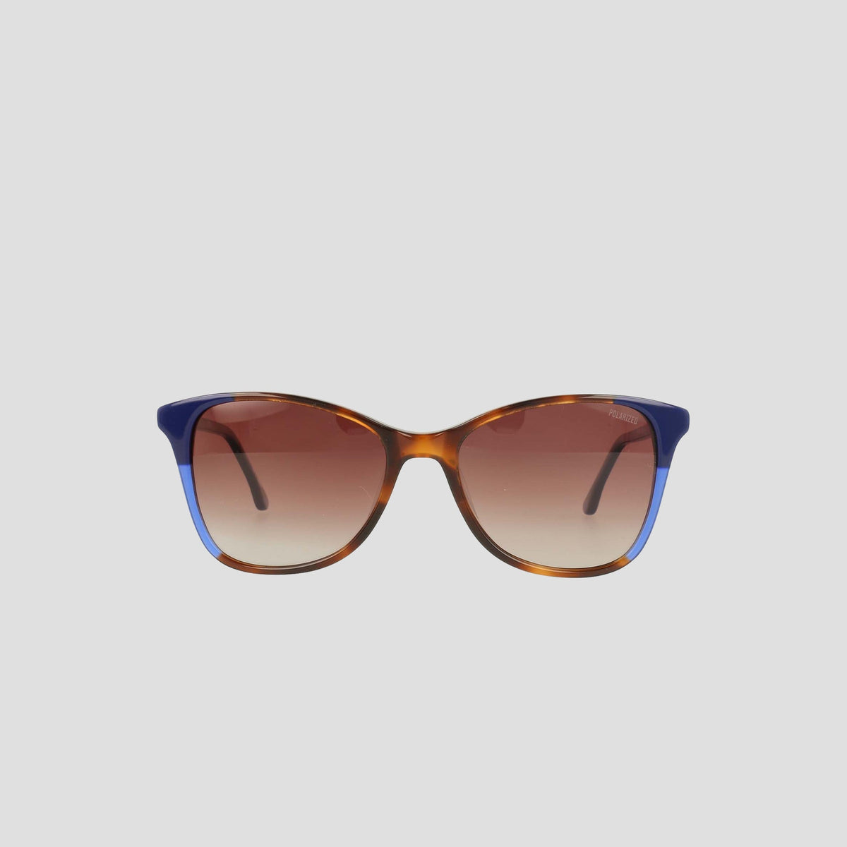 The Champion Women's Polarized Catty Square sunglasses feature a brown and blue gradient cat-eye frame with brown tinted polarized lenses, showcased against a plain light gray background.