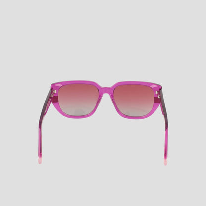 Women's Polarized Modified Cateye sunglasses by Champion, expertly crafted from handmade acetate and featuring gradient-tinted polarized lenses in a modified cateye shape, shown facing forward on a light gray background.