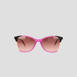 The Champion Women's Polarized Catty Square sunglasses feature a pink and black frame with gradient pink-tinted polarized lenses, showcased against a plain light gray background.