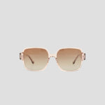 The Champion Women's Polarized Glam Square sunglasses feature oversized square frames in light pink transparent handmade acetate with brown gradient lenses, shown on a plain light gray background.