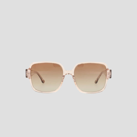The Champion Women's Polarized Glam Square sunglasses feature oversized square frames in light pink transparent handmade acetate with brown gradient lenses, shown on a plain light gray background.