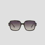 The Champion Women's Polarized Glam Square sunglasses feature oversized black handmade acetate square frames, gradient lenses that fade top to bottom, and subtle striped accents on the temples for added style.