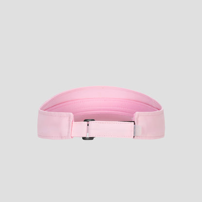 A light pink Champion Adjustable Visor featuring stitching detail, a rectangular black buckle, and a smooth texture offers both style and an adjustable fit, displayed on a plain gray background.