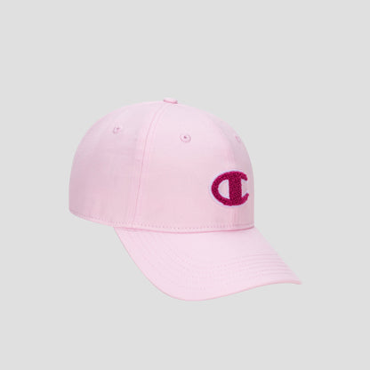 The Champion Amber Chenille Adjustable Baseball Cap features a light pink, unconstructed fit with a curved brim, crafted from premium slub canvas. On the front, it displays a dark pink chenille “C” logo patch. The cap is presented here against a plain gray background.