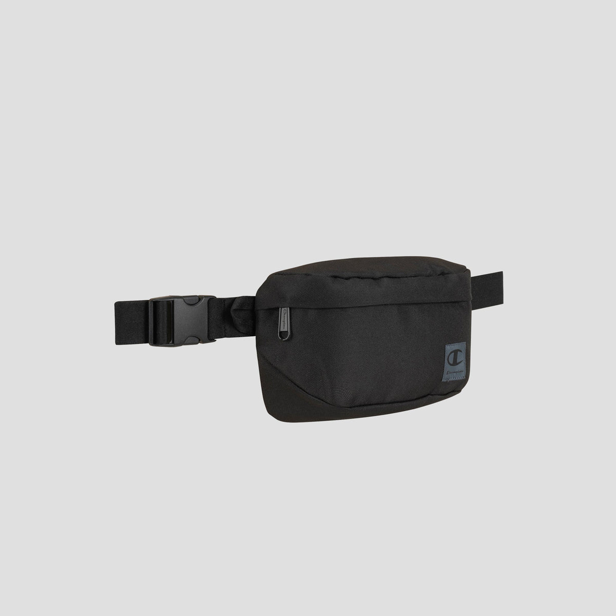 The Atlas Waist Pack by Champion, shown in black against a plain light gray background, features a front zipper pocket and an adjustable buckle strap, providing adventure-ready storage for all your essentials.