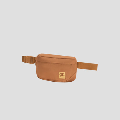 The Atlas Waist Pack by Champion, featuring a brown rectangular design with an adjustable strap, buckle closure, and a small front logo patch, offers hands-free convenience against a plain light background.