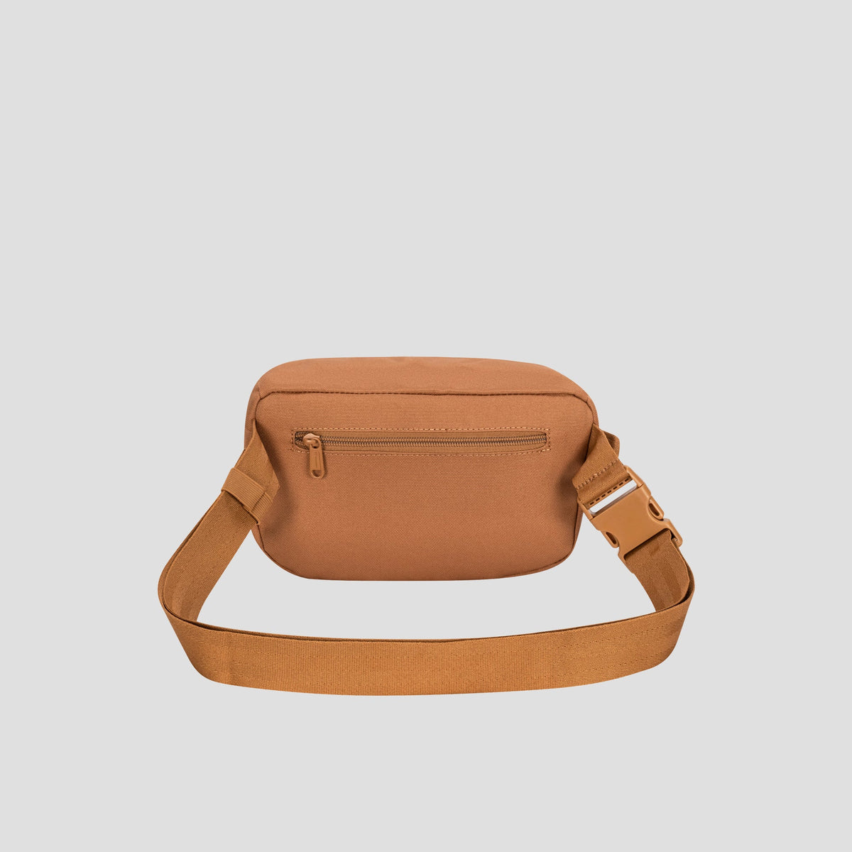 Champion Atlas Waist Pack in tan canvas, featuring an adjustable strap and a front zippered pocket for hands-free convenience, displayed against a plain light gray background.