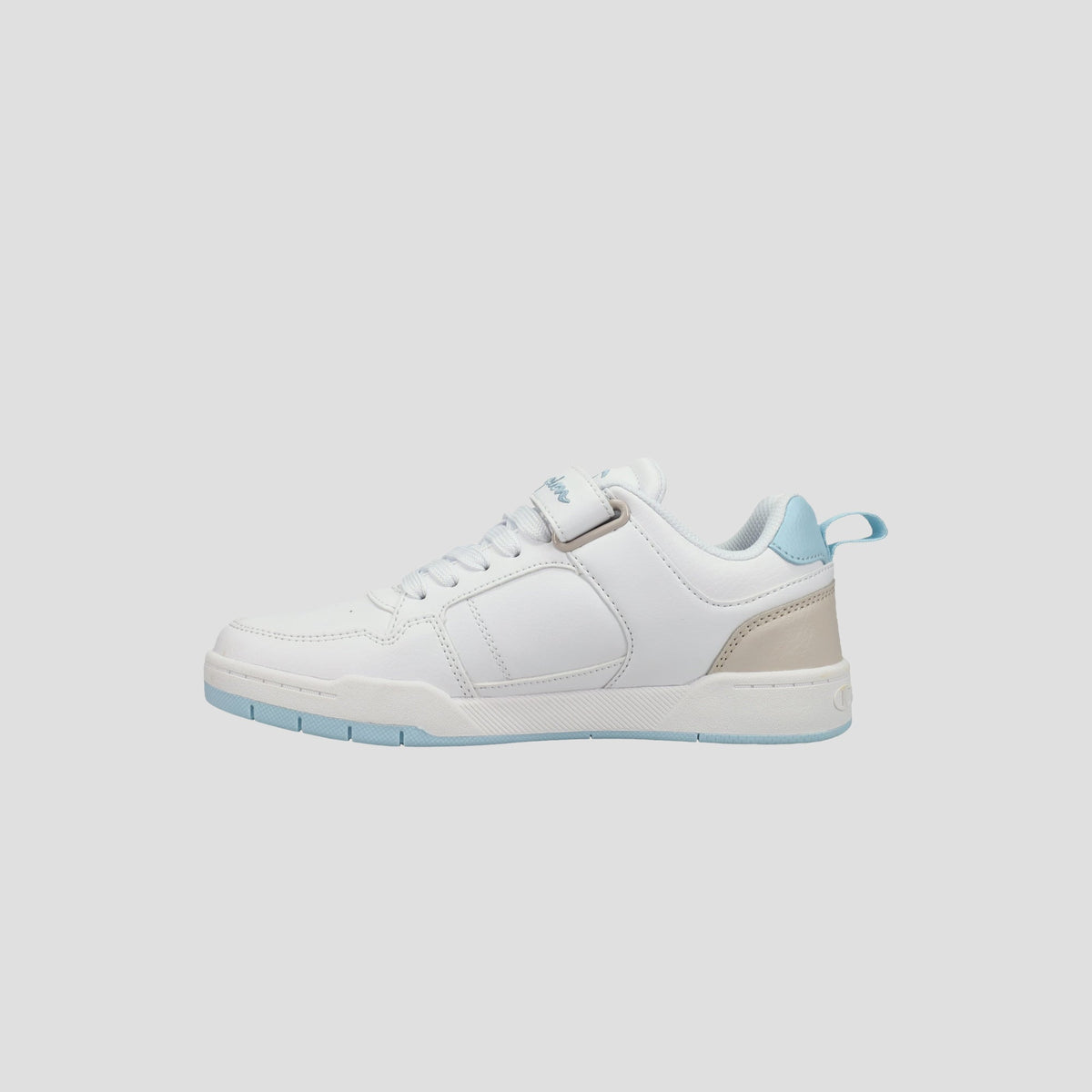 The Champion Kids' Arena Power Low sneaker is white with light blue accents on the sole, heel tab, and lining, plus a beige heel patch. Photographed on a plain light gray background, it's a stylish choice for kids.