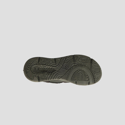 The image displays the sole of the Men's Hyper C Pilot sneaker by Champion, featuring wavy, textured patterns and a central Champion logo on a plain, light background.