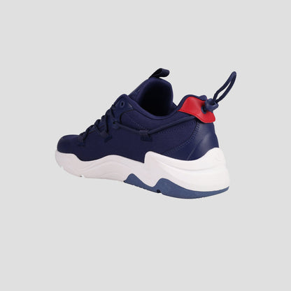 The Champion Men's Hyper C Pilot is a blue lifestyle sneaker featuring a durable mesh upper, white sole, red heel accent, and back pull tab, shown against a plain light gray background.