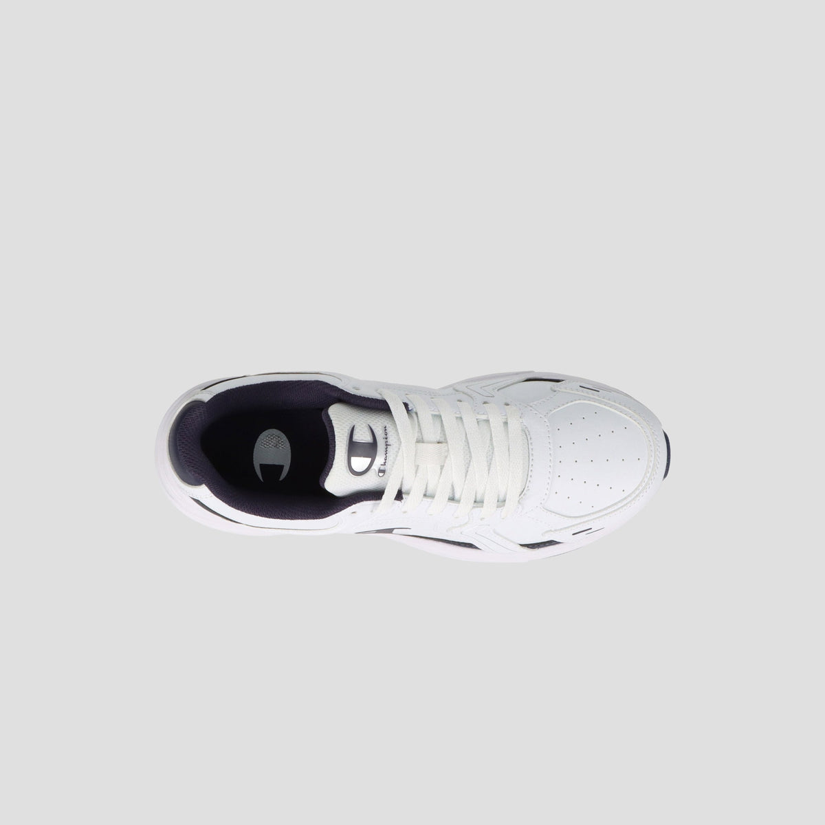 Top view of the Champion Men's Ch Twr 1 lifestyle trainer in white synthetic leather with white laces, perforated toe, cushioned EVA sole, dark interior lining, displayed on a light gray background.