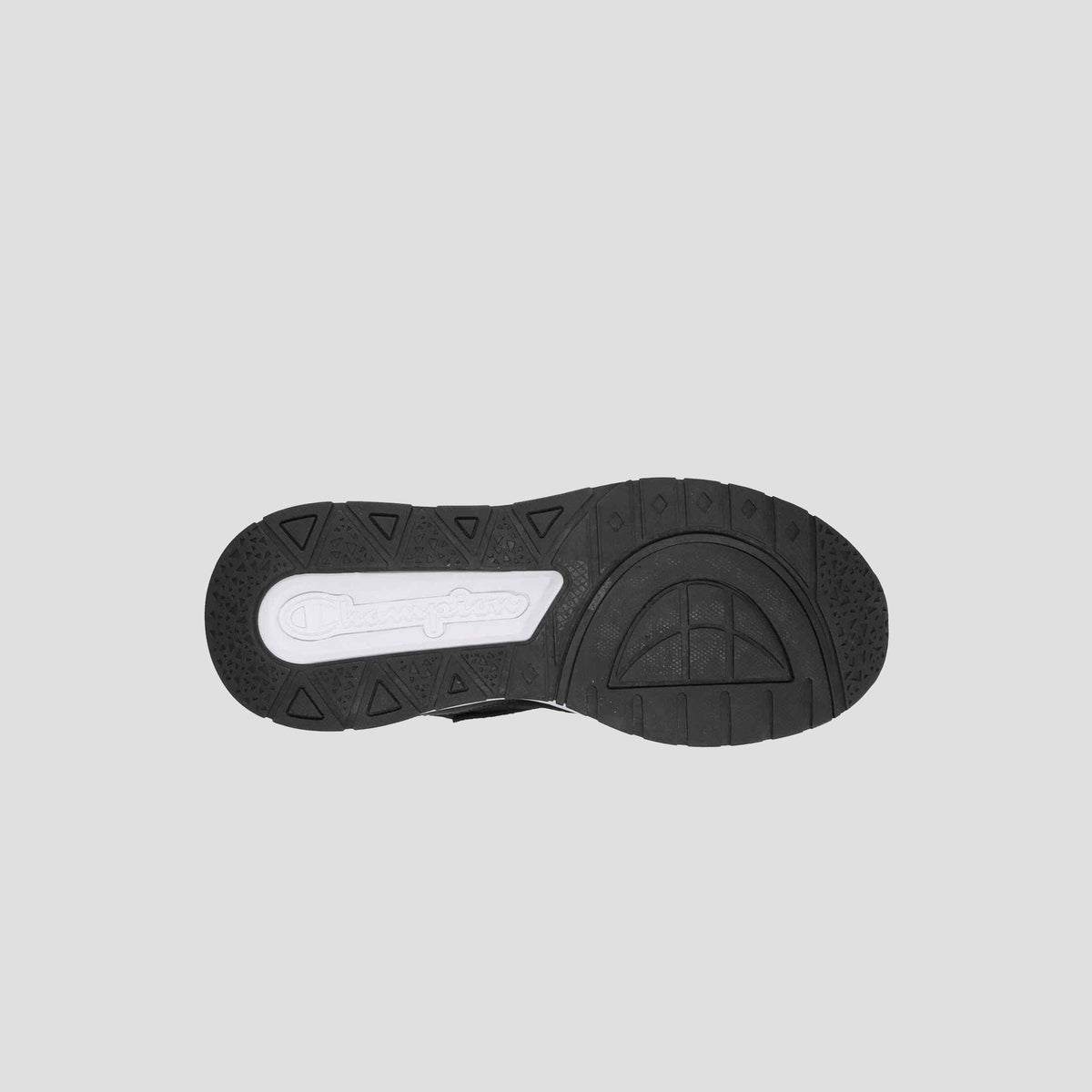 The image shows the black rubber sole of Champion's Men's 9318 Vale sneaker, with a white section displaying the logo and varied tread patterns for grip—perfectly complementing its leather and mesh upper.