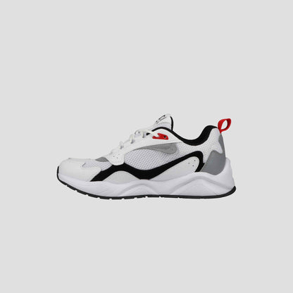 The Champion Men's 9318 Vale sneakers feature a white design with black and gray accents, cushioned collar, rubber sole, and red heel pull tab. These all-purpose men's shoes are shown on a plain light gray background.