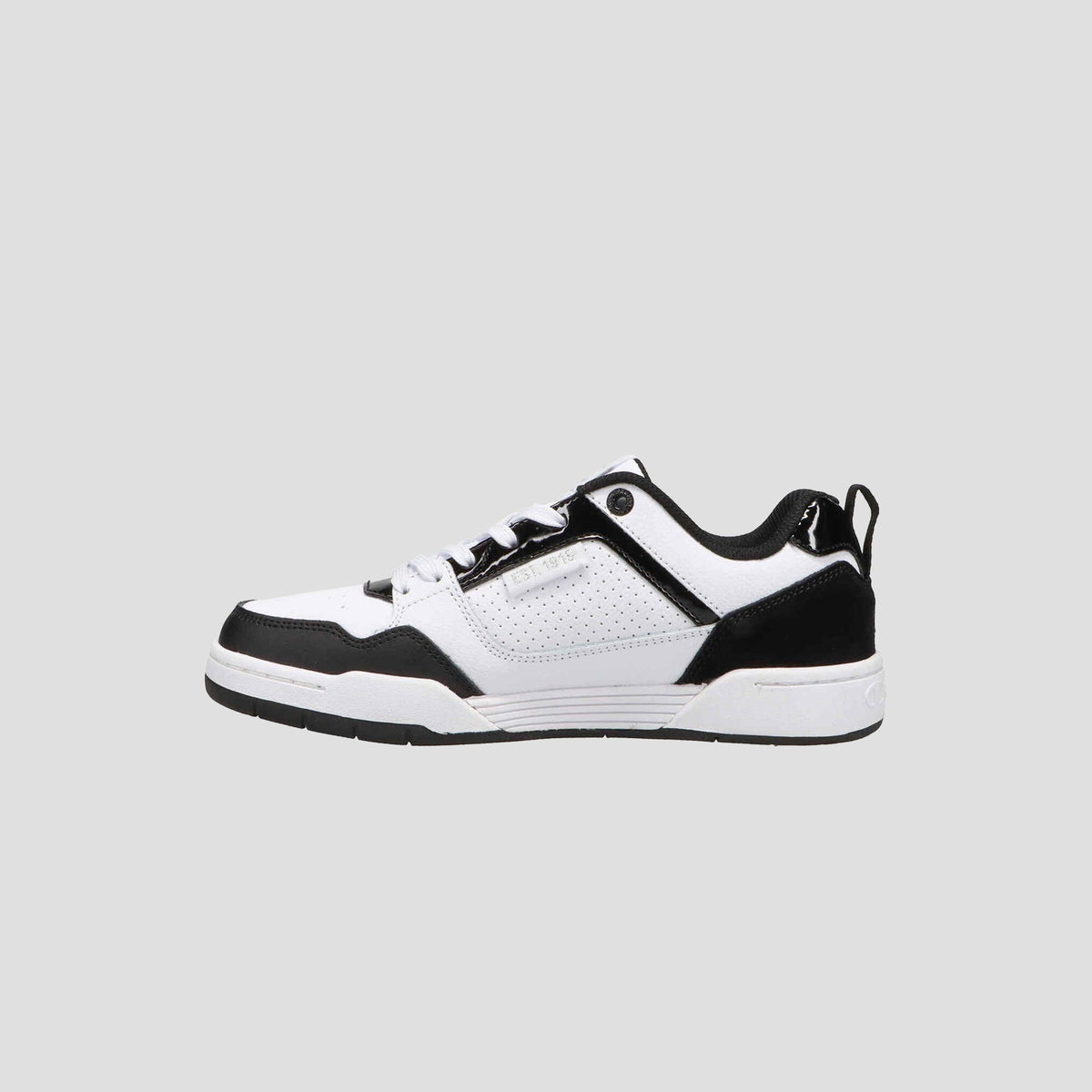 The Champion Women's 5-on-5 Low is a black and white low-top sneaker for women, featuring black laces, a white sole, and black accents on the toe, heel, and lace area, shown against a light gray background.