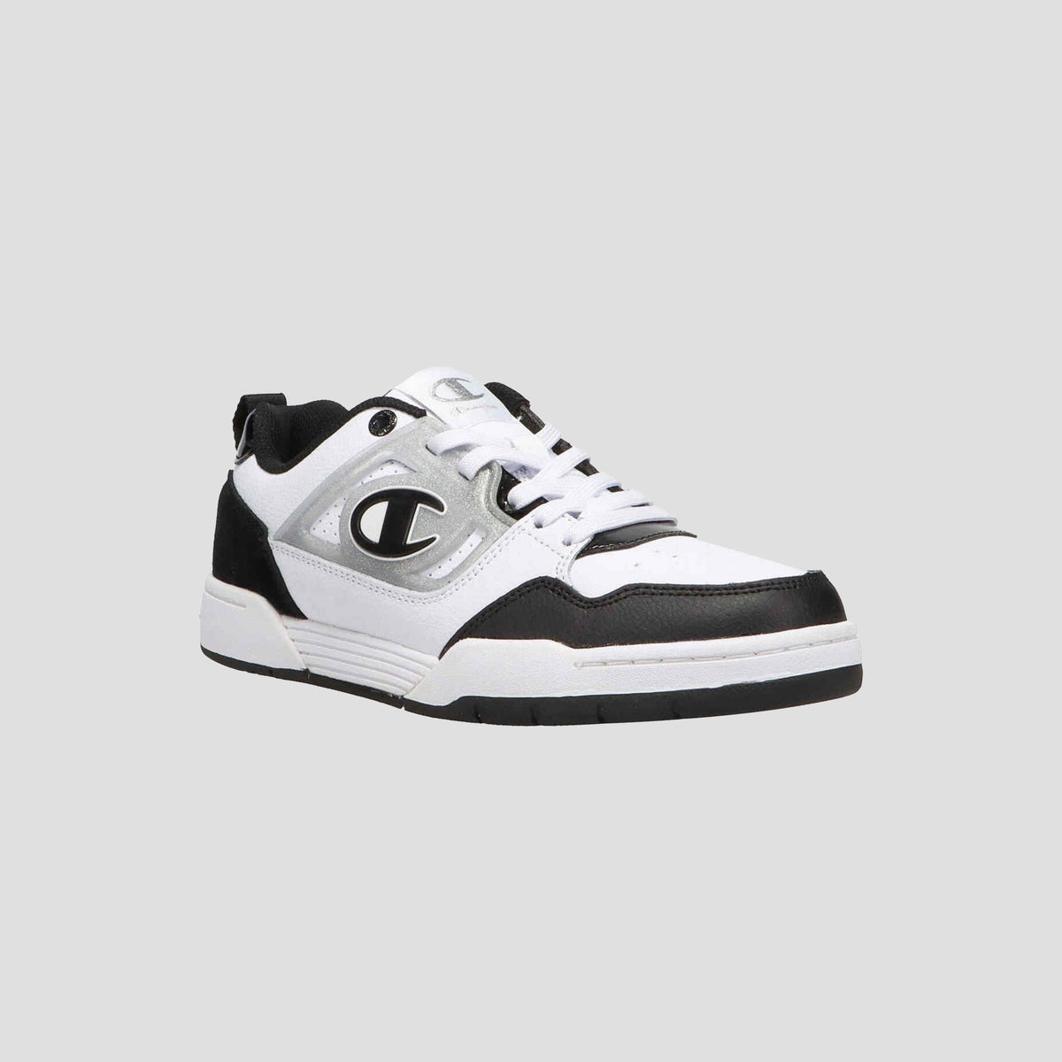 The Champion Women's 5-on-5 Low sneaker in white, black, and gray features a minimalist design with a bold “C” logo on the side, cushioned collar, black outsole, and white laces, shown on a plain light gray background.