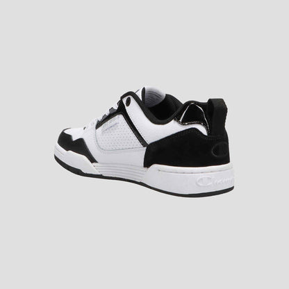 The Champion Women's 5-on-5 Low sneaker features a black and white minimalist design with a cushioned collar, suede accents, and a white sole, shown from the back left angle against a plain light gray background.