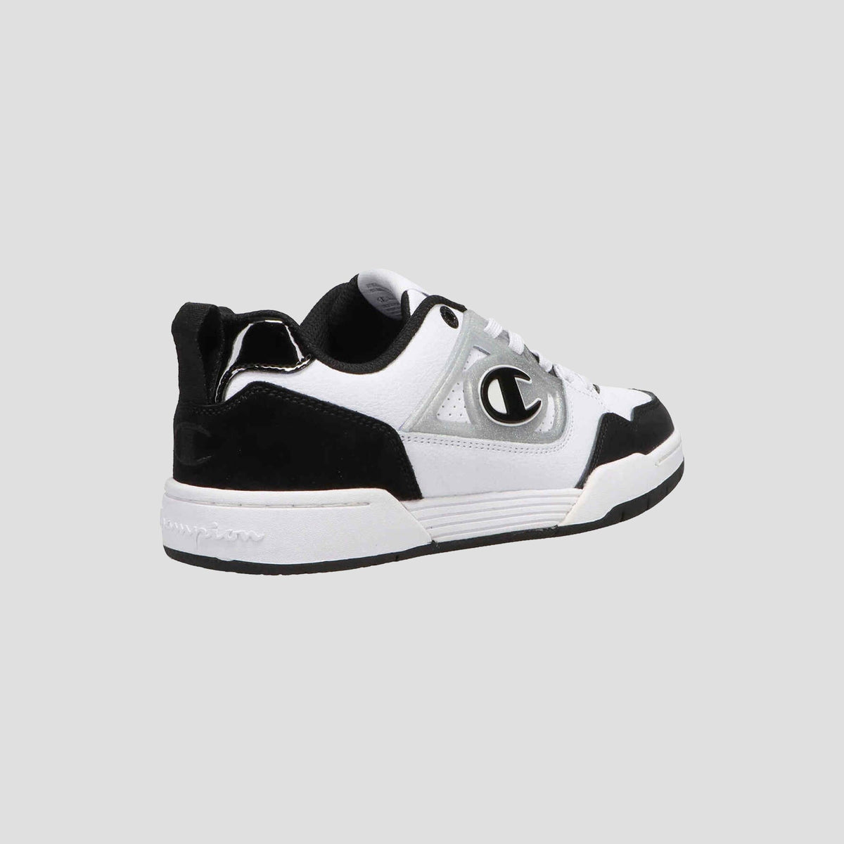 The Champion Women's 5-on-5 Low is a black and white low-top sneaker featuring a cushioned collar, white sole, black heel and toe, gray accents, and a bold C logo—highlighting minimalist design on a light gray background.