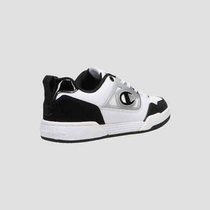 The Champion Women's 5-on-5 Low is a black and white low-top sneaker featuring a cushioned collar, white sole, black heel and toe, gray accents, and a bold C logo—highlighting minimalist design on a light gray background.