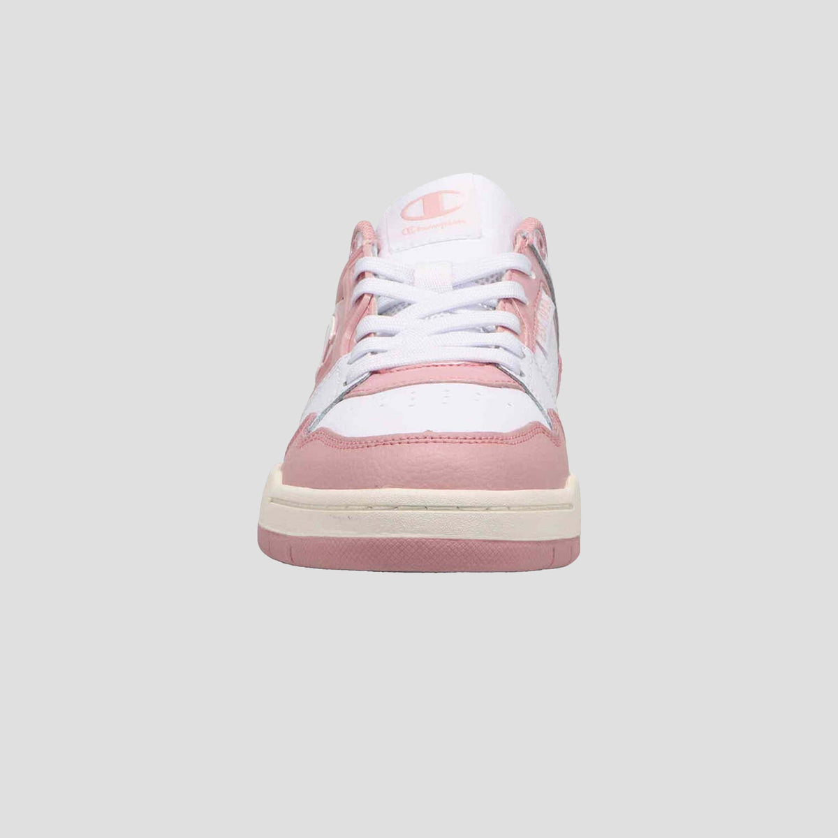 The Champion Women's 5-on-5 Low is a pink and white low-top sneaker with white laces, a cushioned collar, and minimalist design, shown from the front against a plain gray background.