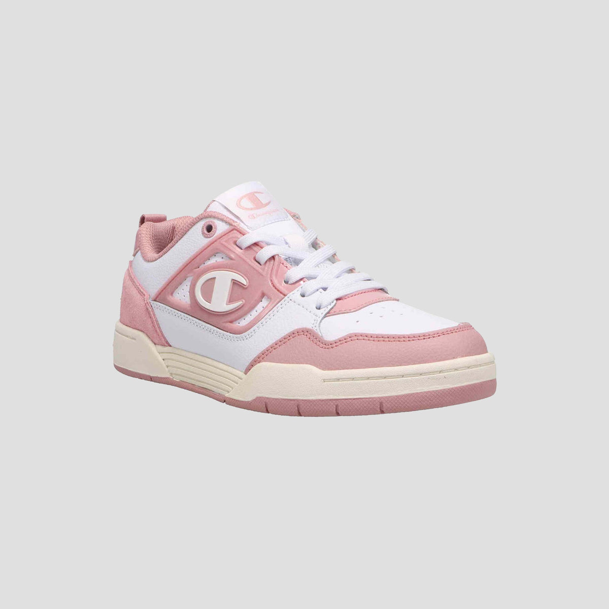 The Champion Women's 5-on-5 Low is a pink and white low-top sneaker featuring a lace-up design, cushioned collar, and bold C logo on the side, displayed against a plain light gray background for a clean look.
