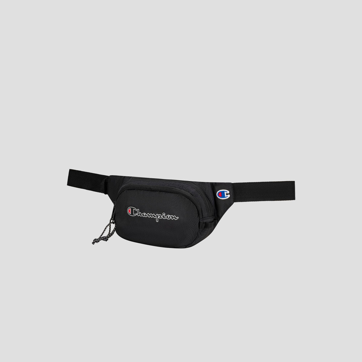 A black Champion Center Waist Pack featuring a front zipper pocket, a logo patch on the front, and an adjustable strap, displayed on a plain light gray background.