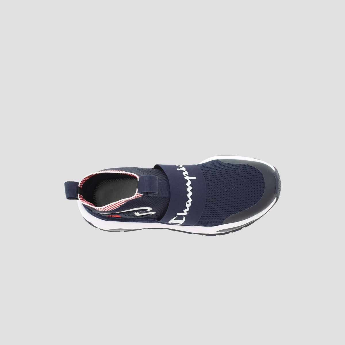 Top view of the Champion Men's Rally Pro: a navy slip-on sneaker with cushioned insole, white sole, black midfoot strap with Champion script, plus red-and-white accents on the heel and inner lining.